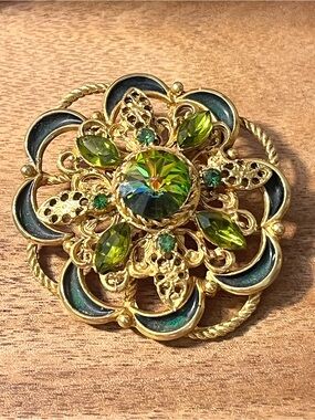 Gold-Tone Floral Brooch with Green Crystal Accents
